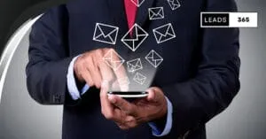 Businessman using smartphone to manage email leads.